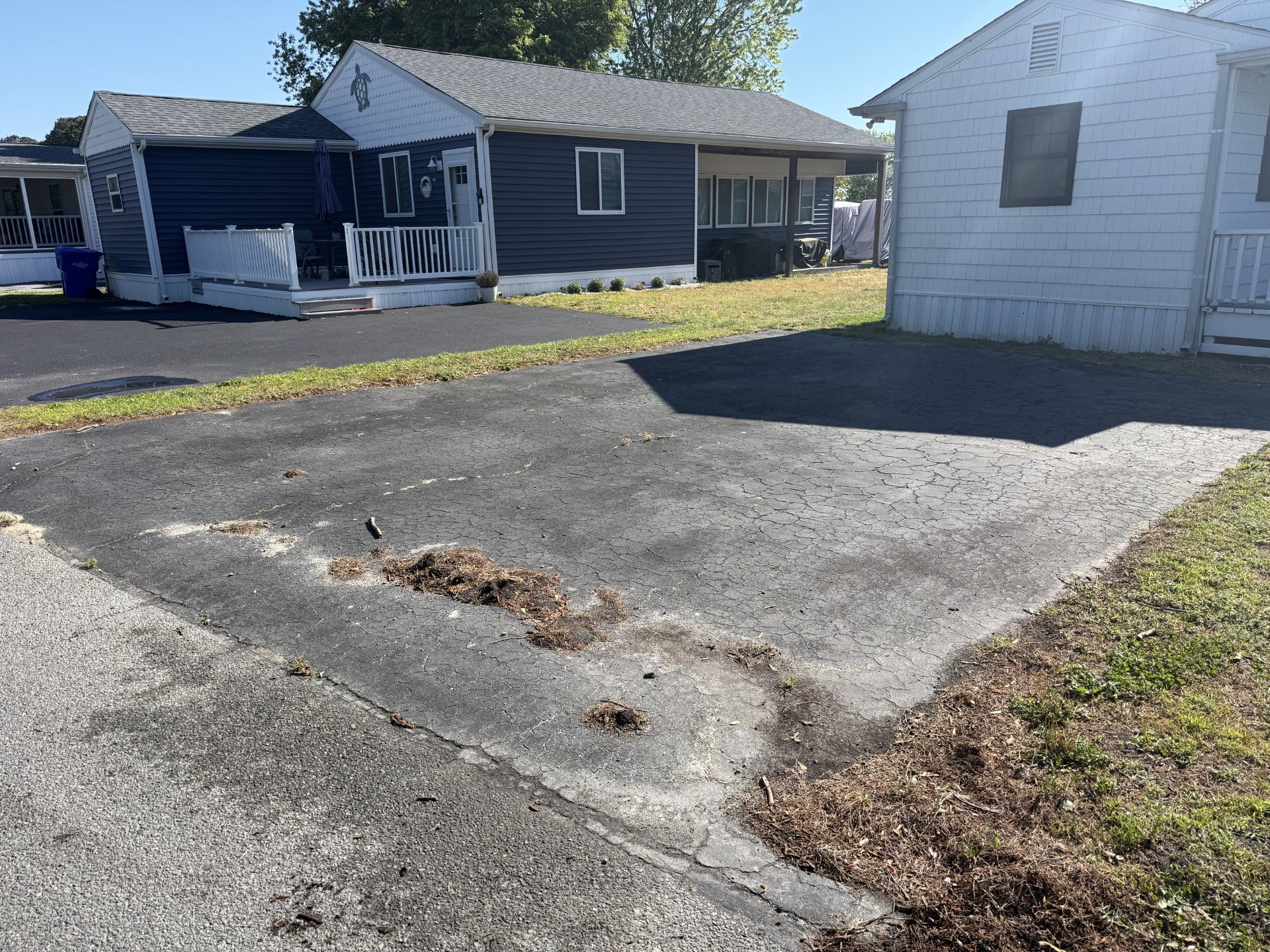 Cracked driveway with surface deterioration before sealcoating
